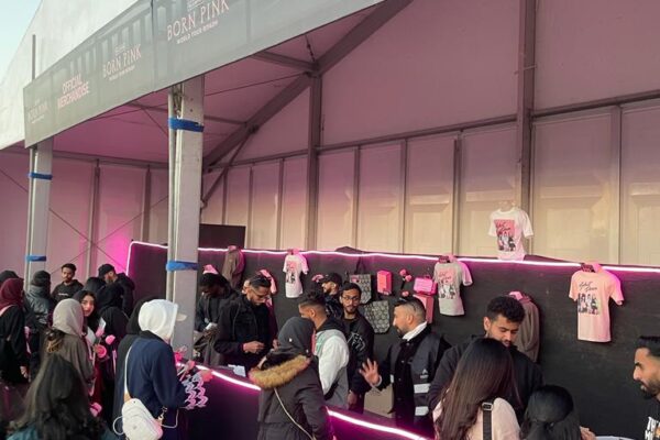 Fans buying merchandise at the Blackpink stand.