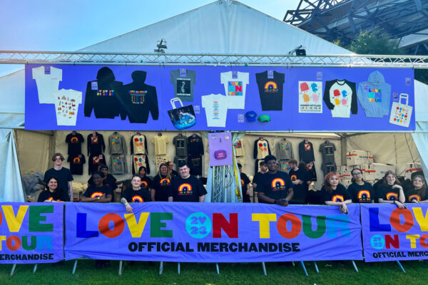 Set up and team in the Harry Styles store.