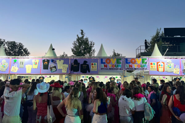 Fans at dusk at the Harry Styles store.