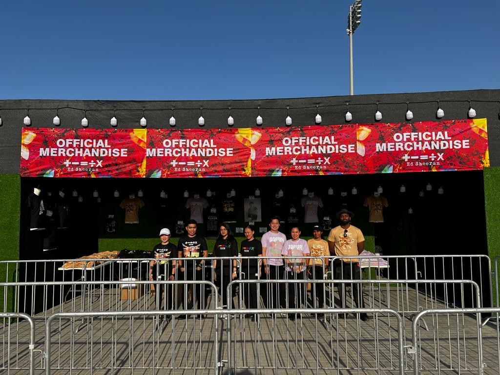 Team standing out side the Ed Sheeran merchandise store.