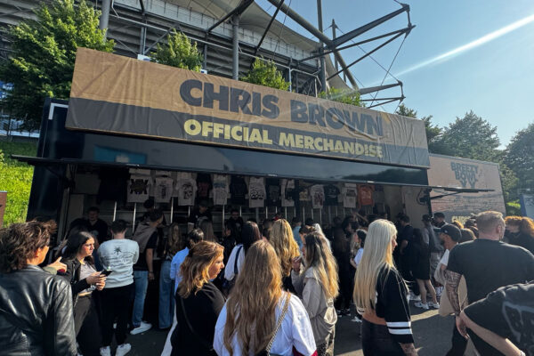 Long shot view of Chris Brown clothing stand outside the stadium.