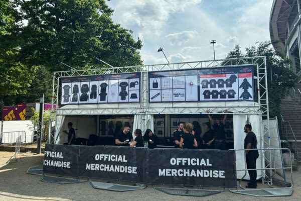 Official Merchandise stand at the Stray Kids tour 2025 - shows twosided stand outside.